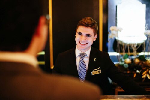 nick-front-desk-agent greeting guest