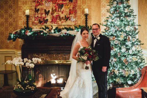 Bride + Groom during holiday season in the lobby at The Lenox