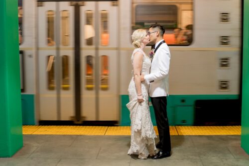 Bride + Groom standing in MBTA station