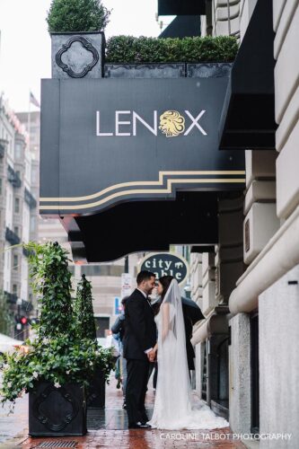 Bride and groom outside Lenox Hotel