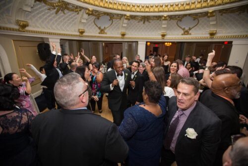 Guests dance during the wedding reception