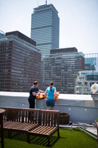 Chef Sean and Director of Responsibility, Samantha Sorrin overlooking the city from the rooftop garden