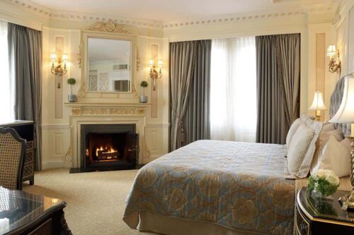 Judy Garland suite with bed and fire in fireplace