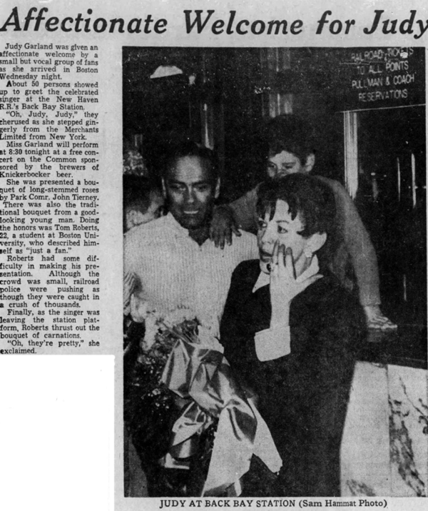 newspaper article of Judy Garland holding flowers