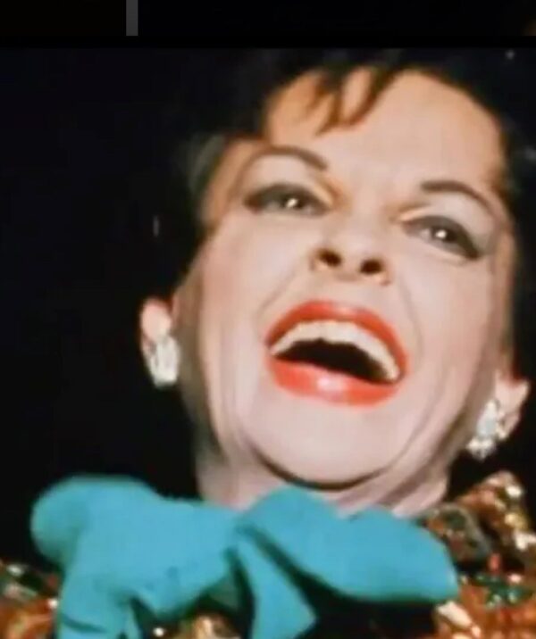 Judy Garland Singing with blue bow on